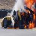 Actual photograph of Earnhardt coming out of the burning car in 2004.  It appears as if something is pulling him from the car as he exists.